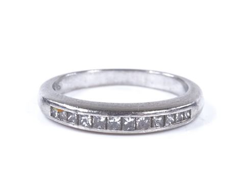 A platinum and Princess-cut diamond half-hoop ring, setting height 3.1mm, size M, 5.4g 