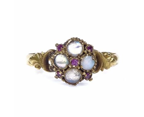 A Victorian 15ct gold opal and ruby dress ring, with relief engraved foliate shoulders, hallmarks Birmingham 1869, setting he