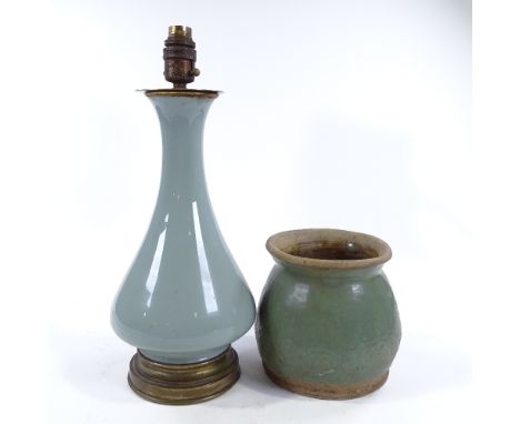 A Chinese Longquan celadon glaze table lamp, with brass mounts, height excluding fitting 34cm, and a celadon glaze relief mou