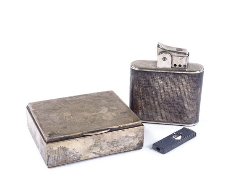 A large silver-cased table lighter, height 9cm, matching cigar cutter, and a silver cigarette box (3) 