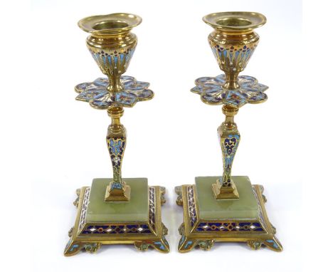 A pair of Victorian brass and champleve enamel candlesticks, with onyx-mounted bases, height 16cm 