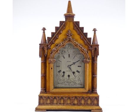 A Victorian Gothic light oak-cased bracket clock, with elaborately carved architectural case with corner columns, engraved si