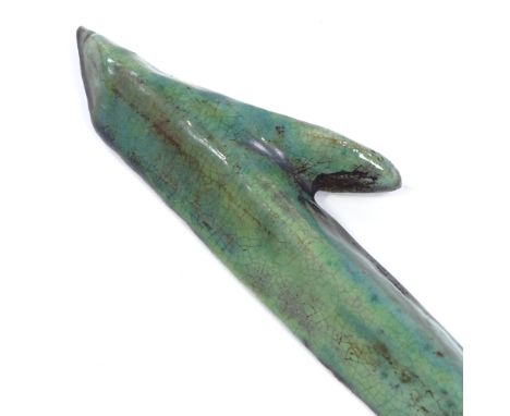 An Islamic green glazed ceramic letter elif, length 35cm 