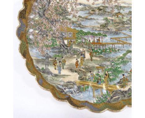 A Japanese Meiji Period Satsuma porcelain bowl, with lobed surround and hand painted detailed gilded scene depicting figures 