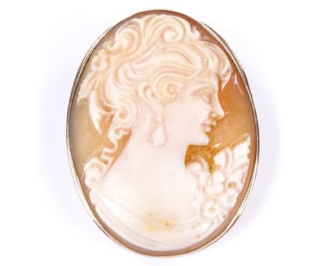 A relief carved shell cameo panel brooch/pendant, depicting female portrait in 9ct frame, brooch length 36.4mm, 5.7g 
