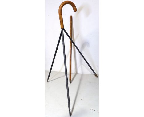 A rare early 20th century Jaki tripod walking stick, the handle unscrewing to reveal a removable camera tripod stand