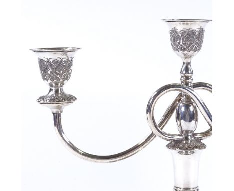 An Iranian silver 2-branch 3-light candelabra, with detailed engraved and relief embossed floral decoration, marks on base, h