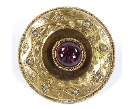 An unmarked gold foil back cabochon tourmaline and split-pearl circular brooch in rope twist surround, brooch diameter 35.5mm