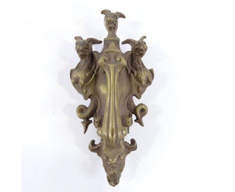 A large cast-brass Griffon design door knocker, height 28cm 