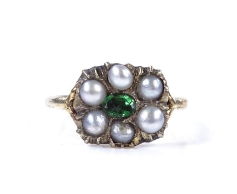 An unmarked yellow metal green stone and split-pearl panel ring, panel height 10.7mm, size L, 1.8g 