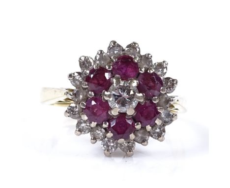 An 18ct gold ruby and diamond cluster flowerhead ring, setting height 13.7mm, size L, 5.1g 