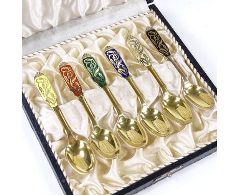 A set of 6 Danish sterling silver-gilt and coloured enamel teaspoons, with stylised floral handles, by W &amp; S Sorensen (Ho