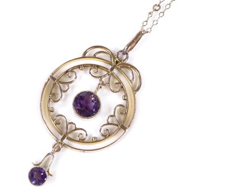 An Edwardian 9ct rose gold amethyst pendant necklace, with openwork stylised settings, on 9ct chain, pendant height excluding