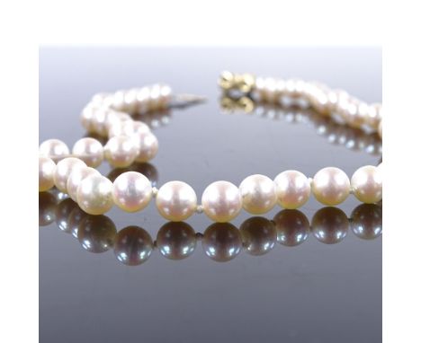 A single-strand choker pearl necklace, with unmarked gold diamond set ribbon clasp, pearl diameter 6.2mm, necklace length 15"