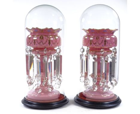 A pair of Victorian pink glass table lustres, with painted gilded decoration, original heavy cut-glass drops, standing under 