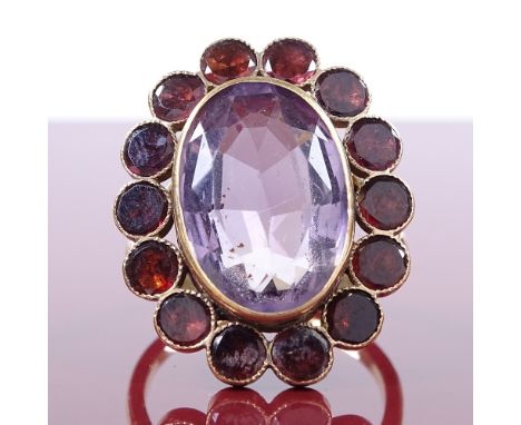 A 9ct gold amethyst and flat-top garnet cluster panel ring, with outer closed back settings, setting height 26.9mm, size R, 7