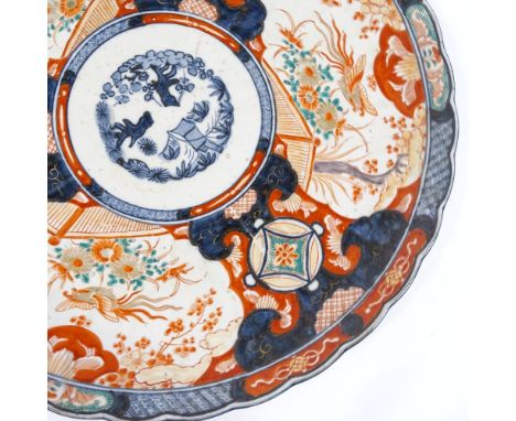 A large Chinese porcelain Imari pattern charger, hand painted and gilded decoration, diameter 46cm, repaired rim damage 