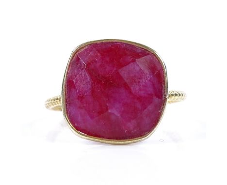 An unmarked silver-gilt faceted ruby panel ring, with milled shank, setting height 15.2mm, size P, 3.3g 