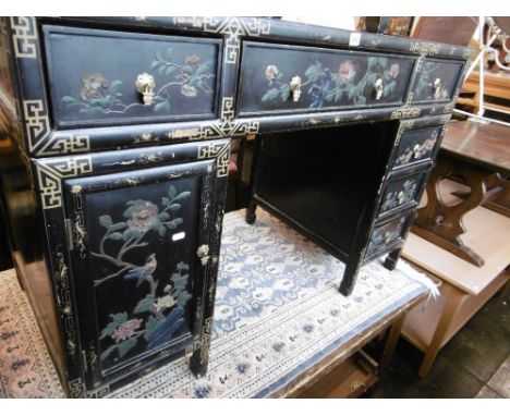 An Chinese lacquered desk and chair