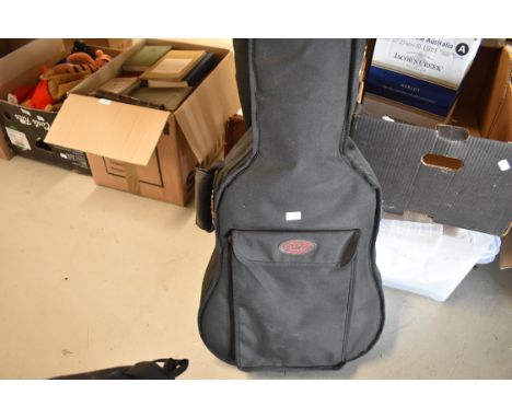 A Stagg classical guitar and a padded gig bag