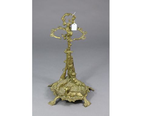 A Victorian-style brass hunting-theme design stick stand, 22” high. 