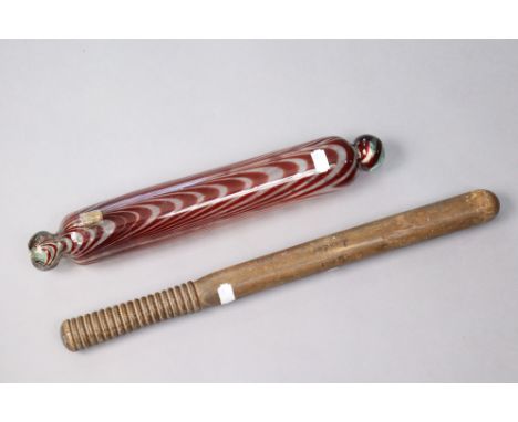 A late 19th century wooden truncheon inscribed “Special London November 1887”, 18”; &amp; a Nailsea-type glass rolling pin, 1