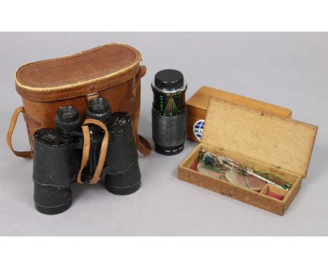 A pair of TS black lacquered 7 x 50mm field glasses, with case; a Hoy 52mm camera lens; &amp; a set of steel travelling beam 