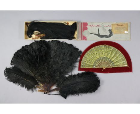 A vintage ostrich (Black) feather fan with a Harrods box; &amp; another vintage fan mounted on a display board. 