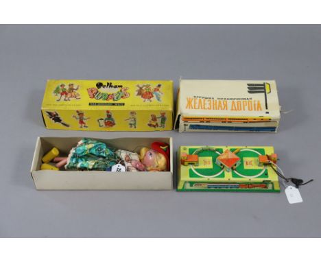 A Pelham standard string puppet “Mitzi”, &amp; an eastern European clockwork-operated tinplate train set, both boxed.