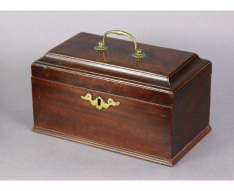 A George III mahogany tea caddy of rectangular form with brass swing handle &amp; shaped escutcheon, hinged lid enclosing a f
