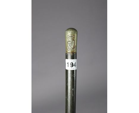 An ebonised wooden swagger stick with a plated knob-end “South Africa”, London Irish Rifles, 34¼” high. 