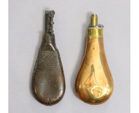 A vintage copper & brass shot flask by G. & J. W. Hawksley, 7¾” wide; & a leather shot flask, 8¼” wide. 