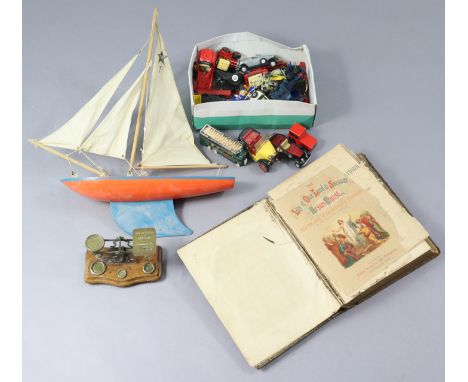 A painted wooden pond yacht; approximately twenty various scale model cars; a vintage brass letter scale; &amp; a vintage lea