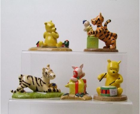 Royal Doulton Winnie the Pooh figures: Rum, tum, tum Winnie on his drum WP63, Happy Christmas Piglet, Tigger plays ball, Boun