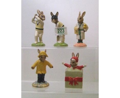 Royal Doulton Bunnykins figures to include: DB144 Batsman, DB145 Bowler, DB146 Christmas Surprise, DB147 Rainy Day and DB148 