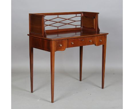 An early 20th century American mahogany and boxwood inlaid lady's writing table, the glazed gallery back fitted with opposing