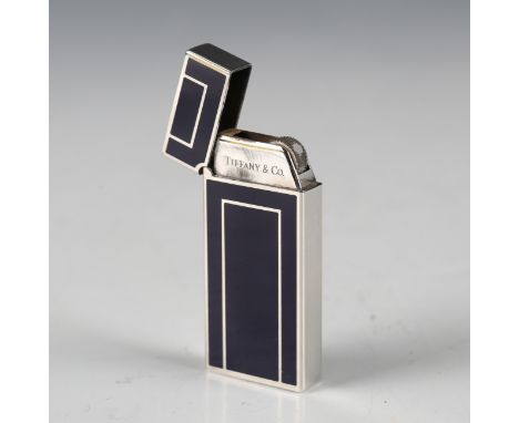 An Art Deco style plated and blue enamel pocket lighter by Tiffany &amp; Co Japan, length 5.6cm, with original cloth pouch.Bu