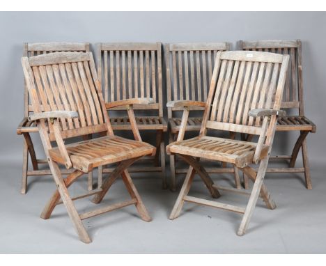 A set of six late 20th century teak folding garden chairs, comprising two armchairs height 96cm, width 56cm, and four standar