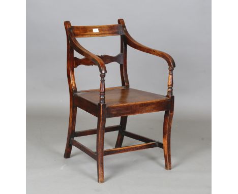 A Regency ash bar back elbow chair with a solid panel seat, on sabre legs, height 87cm, width 52cm.Buyer’s Premium 29.4% (inc
