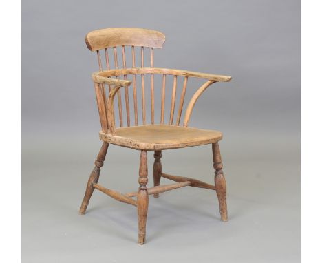 A 19th century ash and elm primitive stick and bar back Windsor armchair, height 83cm, width 55cm.Buyer’s Premium 29.4% (incl