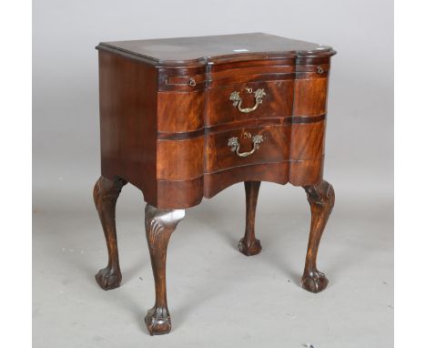 A 20th century reproduction mahogany serpentine fronted chest, fitted with a brushing slide, height 75cm, width 63cm, depth 3