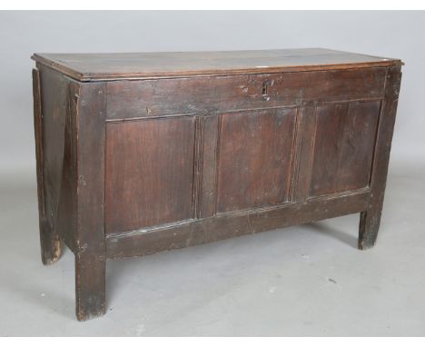 An 18th century oak coffer with triple panel front, on stile supports, height 70cm, width 112cm, depth 43cm.Buyer’s Premium 2