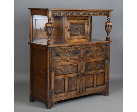A 20th century Jacobean Revival oak court cupboard, height 134cm, width 122cm, depth 48cm.Buyer’s Premium 29.4% (including VA