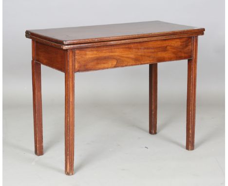 A George III mahogany fold-over tea table, raised on moulded block legs, height 72cm, width 90cm, depth 44cm.Buyer’s Premium 