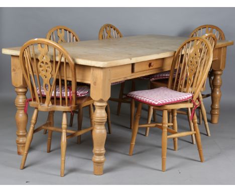 A modern Victorian style pine kitchen table, height 78cm, length 210cm, depth 90cm, together with a set of six stick and whee