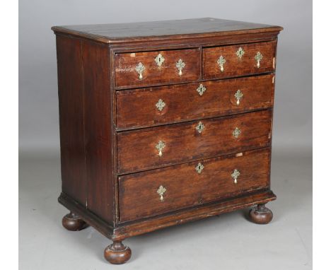 An 18th century provincial oak and walnut crossbanded chest of drawers, raised on bun feet, height 99cm, width 94cm, depth 56