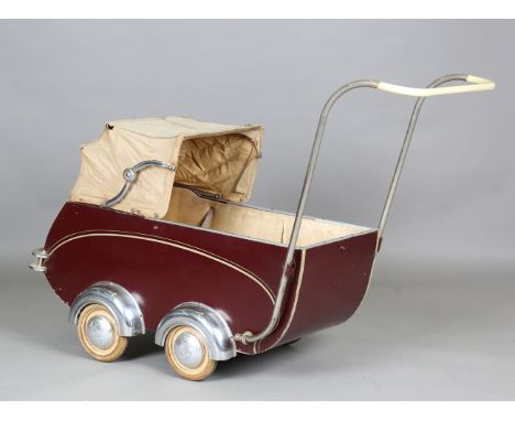 A Continental Art Deco pram by Torck, modelled in the form of an automobile with chromium plated wheel arches and hub cap cov