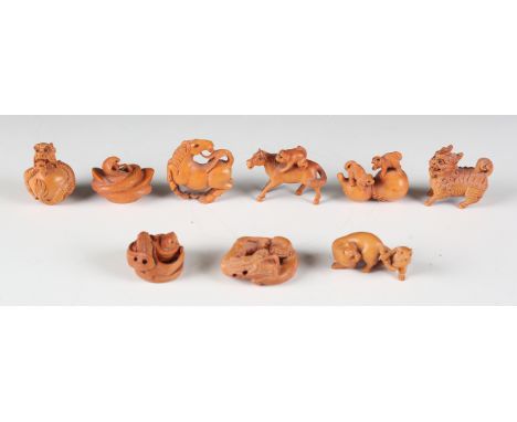 A group of nine modern Japanese carved boxwood Netsuke, including, a dragon chasing a flaming pearl, height 5cm, a cobra coil