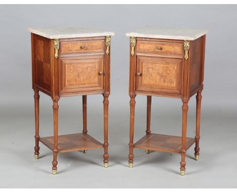A pair of early 20th century French marble-topped bedside cabinets with ormolu mounts and ceramic-lined interiors, height 82c