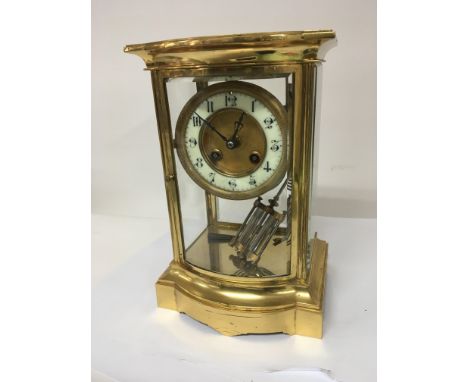 A Quality gilt metal four glass mantel clock with a dome front and with visible mercury double pendulum detached. With key no